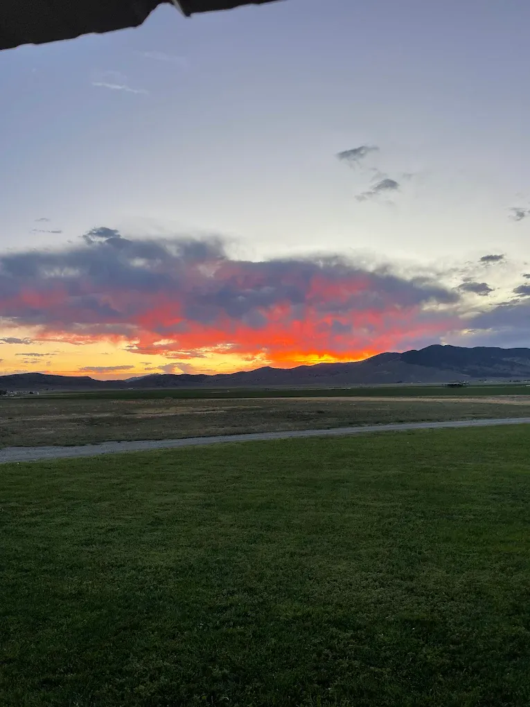 Sunset over Nevada mountains and hay fields