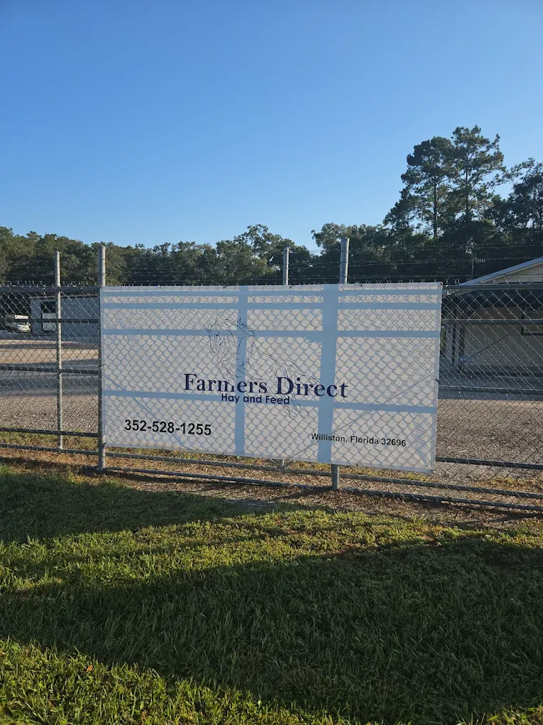 Farmers Direct Hay and Feed road sign with phone number